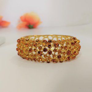 LOVELY ENCRUSTED AMBER RHINESTONE HINGED BRACELET